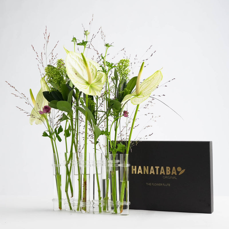 hanataba glass vases linked together creating a chain of minimalist glass vases 